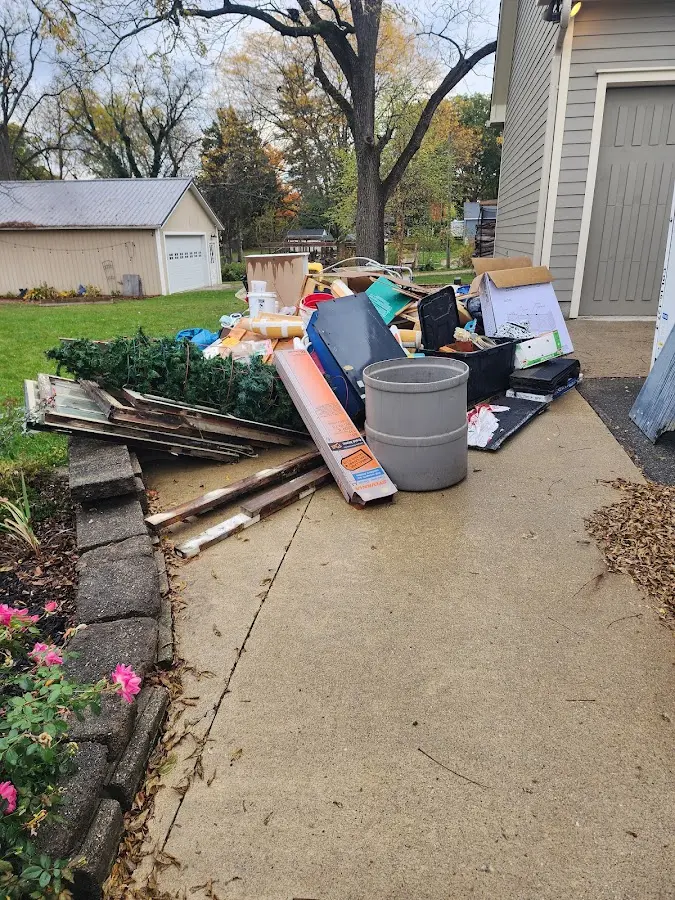 Dumpster being loaded with debris for Roofing Dumpster Rental in Haworth
